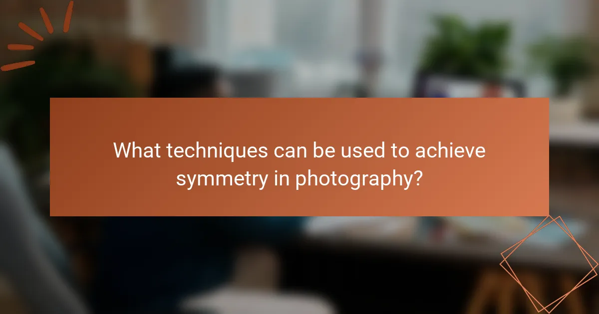 What techniques can be used to achieve symmetry in photography?